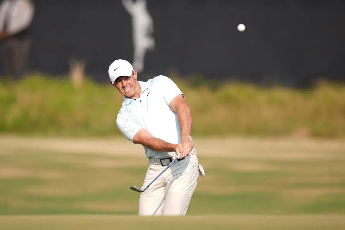 Jun 16, 2024; Pinehurst, North Carolina, USA; Rory McIlroy pitches onto the eighteenth green during the final round of the U.S. Open golf tournament. Jim Dedmon-USA TODAY Sports