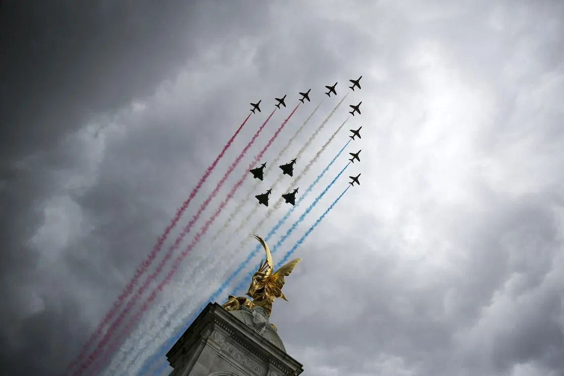 The Royal Air Force's Red Arrows flypast over Buckingham Palace to commemorate the 80th anniversary of Victory in Europe Day in London, Britain, on May 5, 2025. 