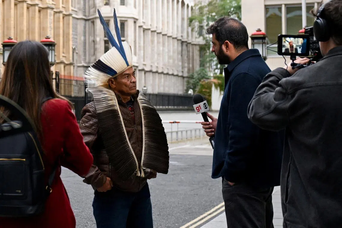 FILE PHOTO: Cacique Bayara, leader of the Pataxo Geru-Tucuna village, located in the municipality of Acucena in Minas Gerais, Brazil, speaks to the media outside the Rolls Building of the High Court amid a lawsuit against the BHP Group over the 2015 collapse of the Mariana dam in Brazil, in London, Britain, October 21, 2024. REUTERS/Jaimi Joy/File Photo