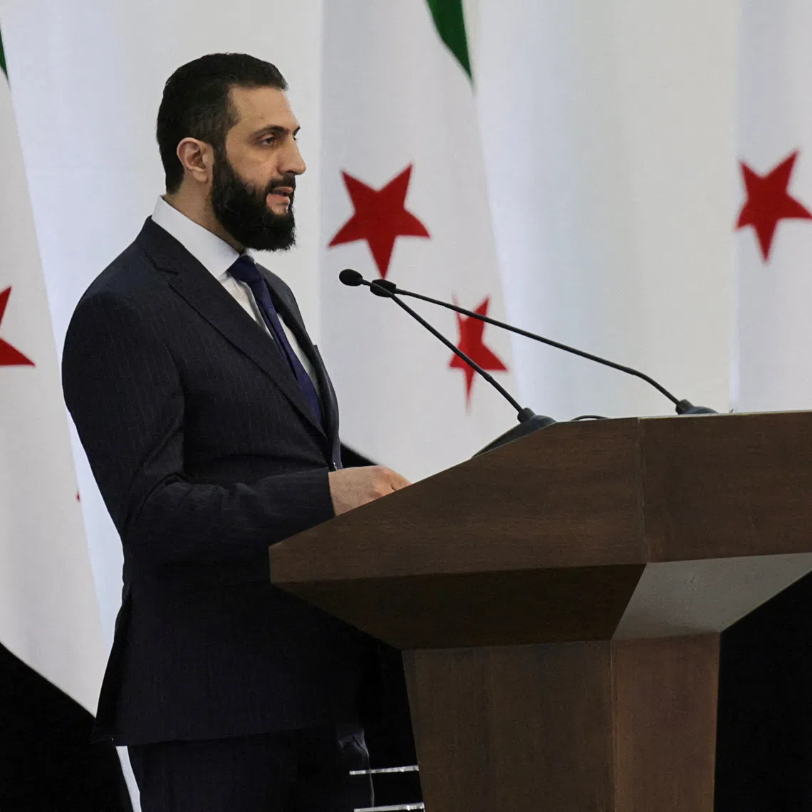 Syria's interim President Ahmed al-Sharaa speaks during a Ministerial formation of the government of the Syrian Arab Republic, in Damascus, Syria March 29, 2025. REUTERS/Khalil Ashawi