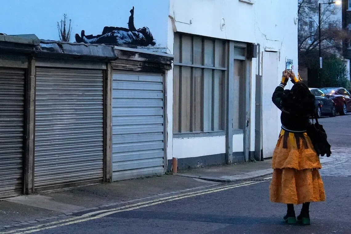 British street artist Banksy unveils latest mural in London
