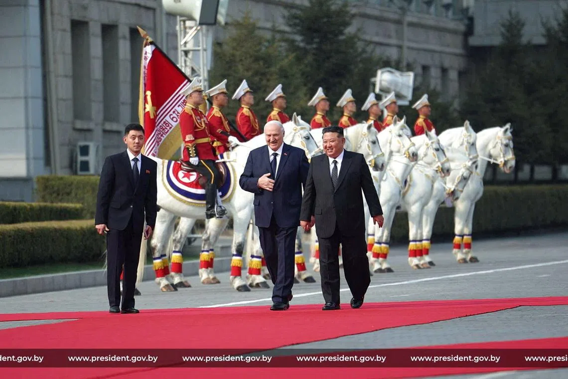 Belarusian President Alexander Lukashenko and North Korean leader Kim Jong Un walk during a meeting in Pyongyang, North Korea March 25, 2026. President of the Republic of Belarus/Handout via REUTERS