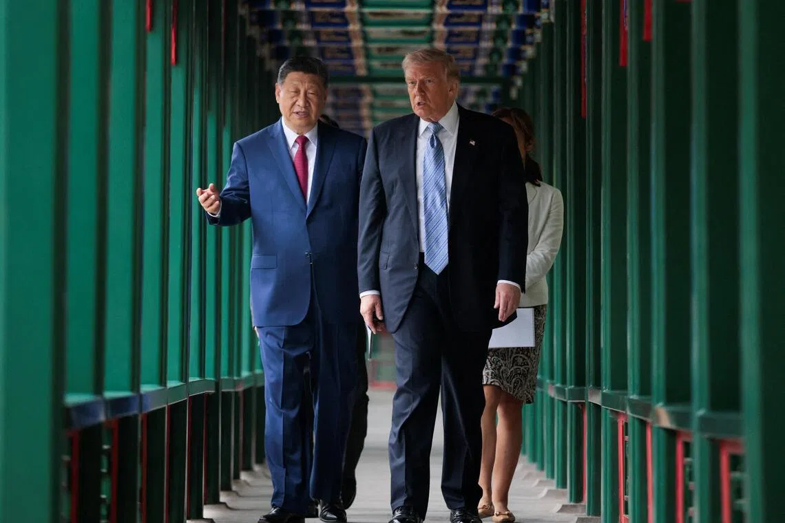 US President Donald Trump participates in a friendship walk through Zhongnanhai Garden with Chinese President Xi Jinping in Beijing, China, May 15, 2026.