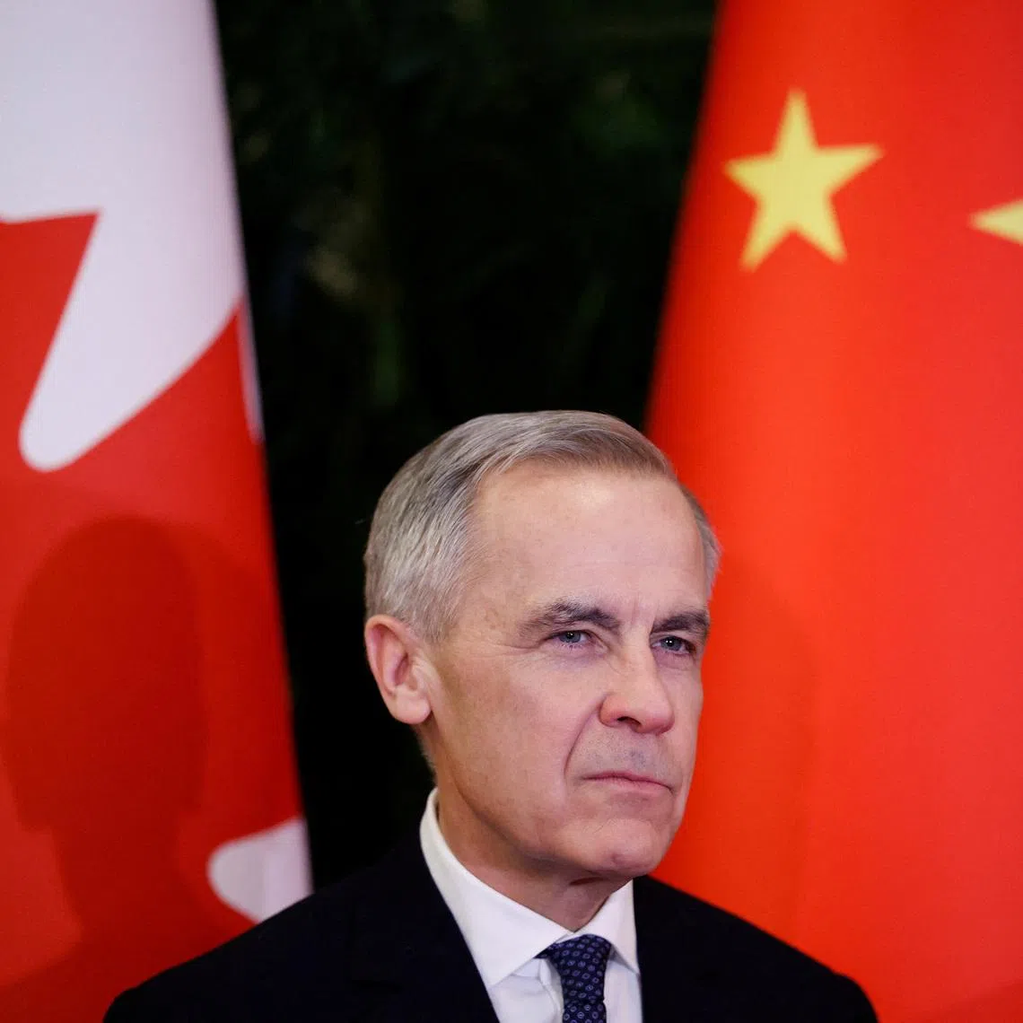 Canada's Prime Minister Mark Carney looks on as he meets the Chairman of the Standing Committee of the National People's Congress of China Zhao Leji (not pictured), during the first visit by a Canadian Prime Minister to China since 2017, at the Great Hall of the People, in Beijing, China, January 15, 2026. REUTERS/Carlos Osorio