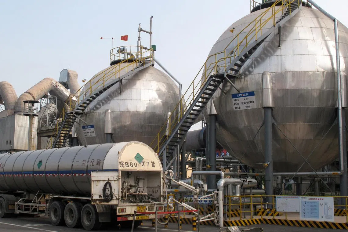 FILE PHOTO: Carbon dioxide storage tanks are seen at a cement plant and carbon capture facility in Wuhu, Anhui province, China September 11, 2019. Picture taken September 11, 2019. REUTERS/David Stanway/File Photo