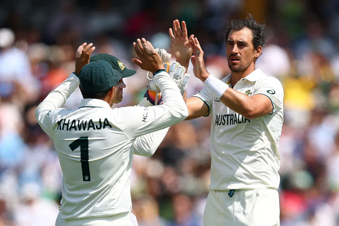 Cricket - 2025 ICC World Test Championship Final - South Africa v Australia - Lord's Cricket Ground, London, Britain - June 14, 2025 Australia's Mitchell Starc celebrates with Usman Khawaja after bowling out South Africa's Tristan Stubbs Action Images via Reuters/Andrew Boyers