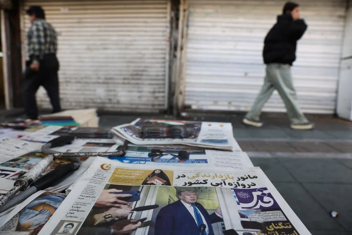 An Iranian newspaper with a cover photo of U.S. President Donald Trump, in Tehran, Iran, February 19, 2026. Majid Asgaripour/WANA (West Asia News Agency) via REUTERS