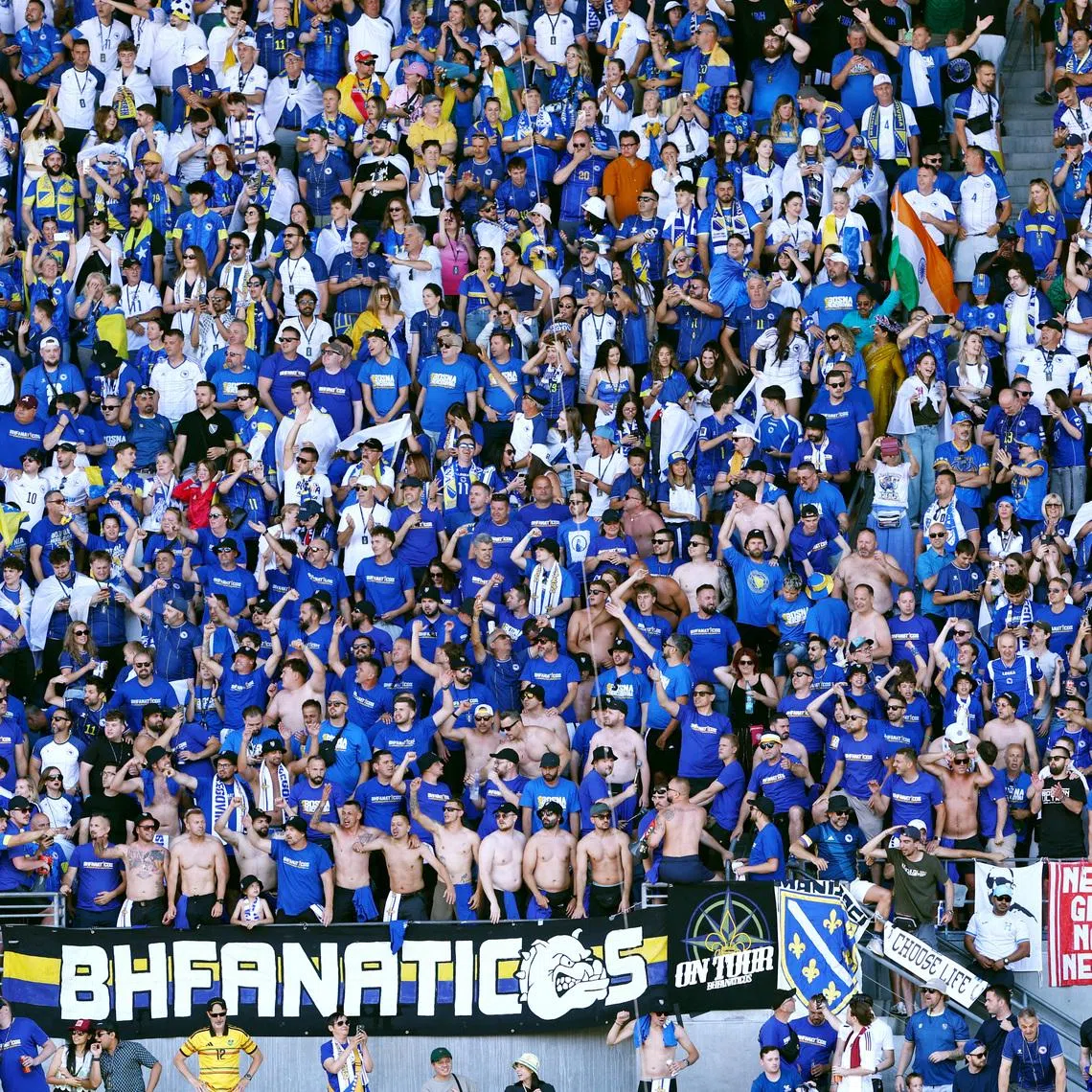 FILE PHOTO: Soccer Football - FIFA World Cup 2026 - Group B - Bosnia and Herzegovina v Qatar - Seattle Stadium, Seattle, Washington, U.S. - June 24, 2026 Bosnia and Herzegovina fans celebrate after Bosnia and Herzegovina's Kerim Alajbegovic scores their first goal REUTERS/Eloisa Lopez/File Photo