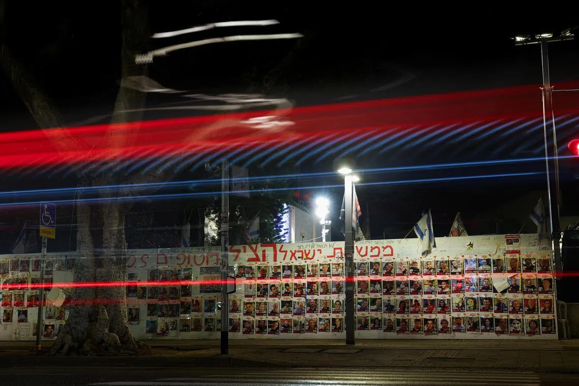 Posters with images of hostages kidnapped in the deadly Oct 7 attack on Israel by the Palestinian Islamist group Hamas are seen in Tel Aviv on  April 10. 