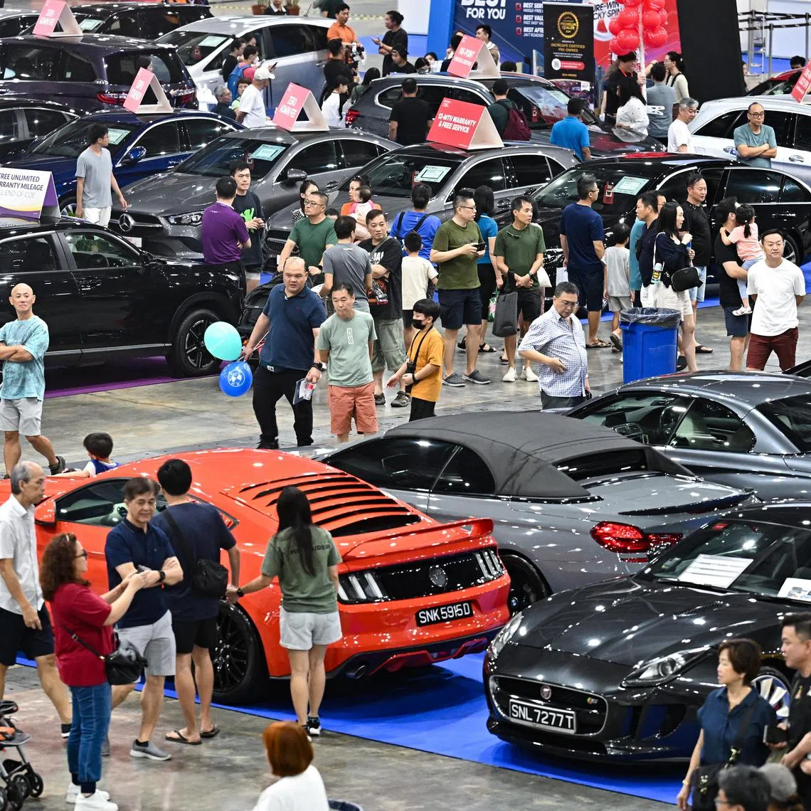 ST20240413-202497341066-Lim Yaohui-Esther Loi-elcar13/
Visitors looking at pre-owned cars at Car Expo at Singapore Expo on Apr 13, 2024.
Car Expo returns for its biggest post-Covid show on the weekend of April 13 and 14. The Car Expo is a mega automotive show that provides car buyers with attractive and great deals for brand new and pre-owned cars, and motoring accessories.
A new EV car brand, GAC Aion will be participating and launching 3 new car models at the show.
(ST PHOTO: LIM YAOHUI)
