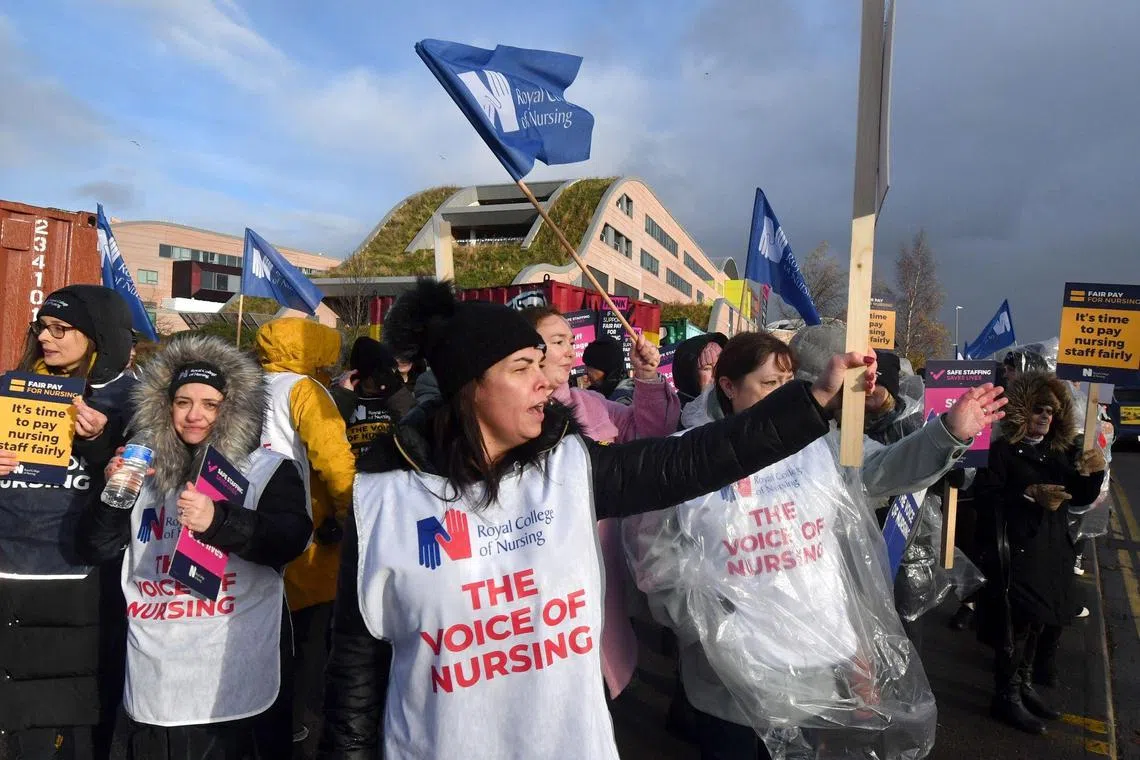 Demonstrators at a strike by NHS nursing staff outside Alder Hey Children's Hospital in Liverpool, on Dec 20, 2022.