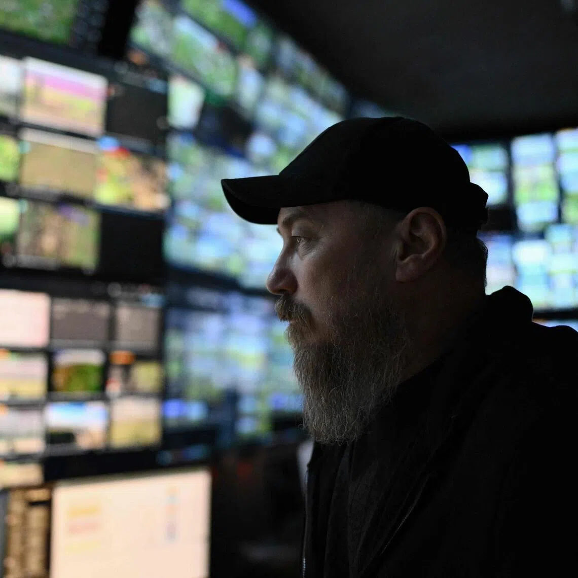 The Commander of Ukraine's Unmanned Forces Robert Brovdi's underground command post features walls of blinking screens playing footage of Ukrainian drones attacking Russian troops and scoreboards of destroyed targets.