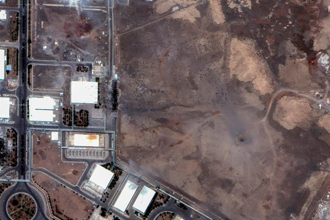 A Maxar satellite image shows airstrike craters over the underground centrifuge halls of Iran's Natanz Enrichment Facility, following US airstrikes.