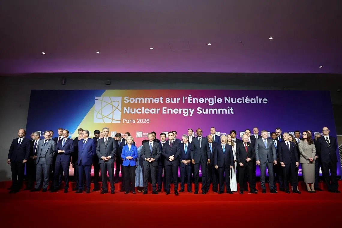 French President Emmanuel Macron and Rafael Grossi, Director General of the International Atomic Energy Agency (IAEA), and European Commission President Ursula von der Leyen pose with heads of state and government for a family photo during the IAEA Nuclear Energy Summit in Paris, France, March 10, 2026.