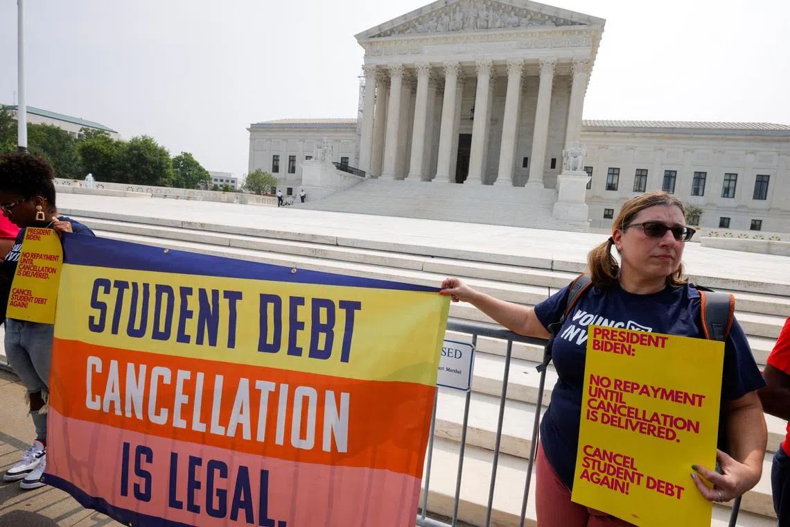 FILE PHOTO: Supporters of U.S. President Joe Biden's plan to cancel $430 billion in student loan debt react outside the U.S. Supreme Court, after the court ruled against Biden in a 6-3 decision favoring six conservative-leaning states that objected to the policy, in Washington, U.S. June 30, 2023.  REUTERS/Jim Bourg/File Photo