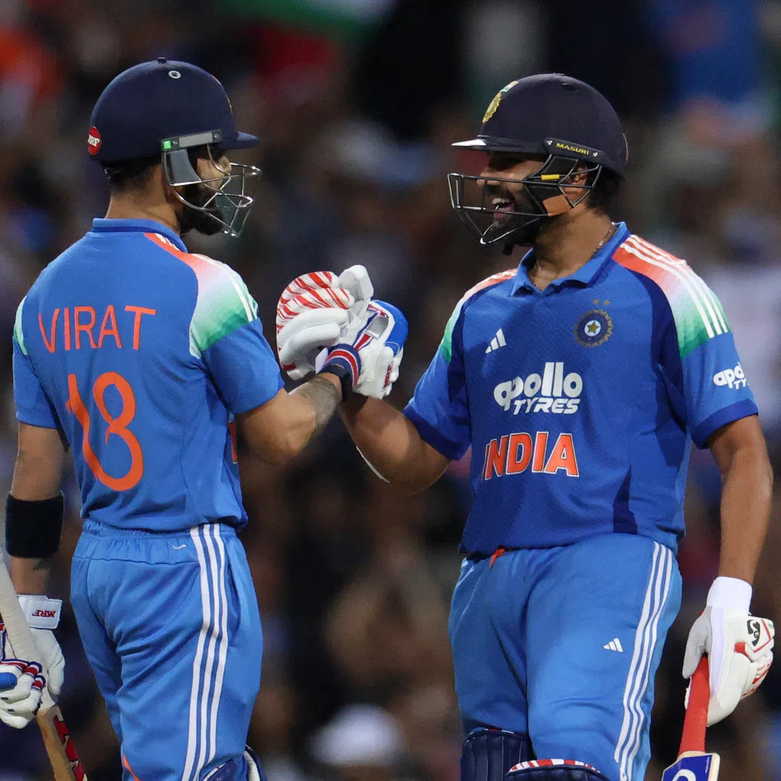 Cricket - One Day International - Australia v India - Sydney Cricket Ground, Sydney, Australia  - October 25, 2025 India's Rohit Sharma and Virat Kohli celebrate after winning the match. REUTERS/Hollie Adams