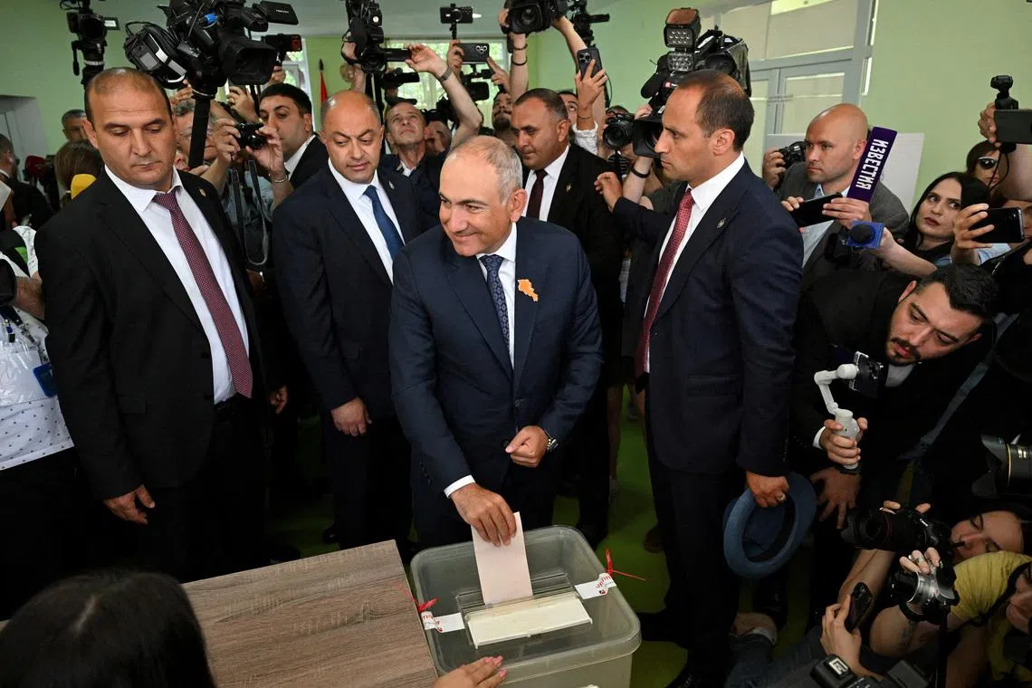 FILE PHOTO: Armenian Prime Minister and leader of the Civil Contract party Nikol Pashinyan casts a ballot at a polling station during a parliamentary election in Yerevan, Armenia, June 7, 2026. Stringer/Photolure via REUTERS/File Photo