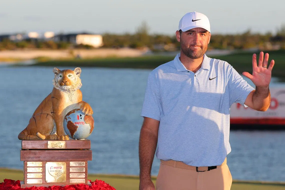 Scottie Scheffler of the United States celebrates with the trophy after winning the Hero World Challenge.
