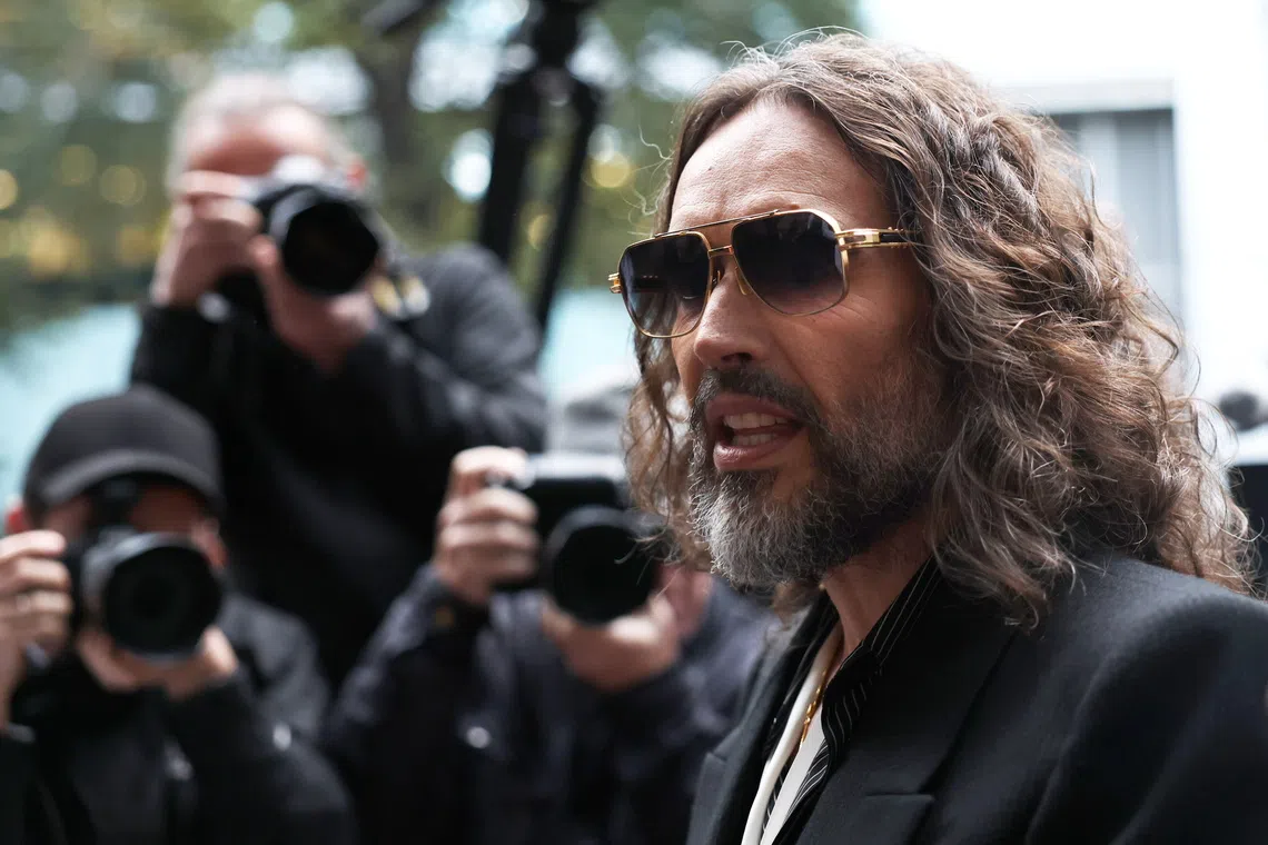 British comedian and actor Russell Brand arrives at Southwark Crown Court in London on Oct 14.