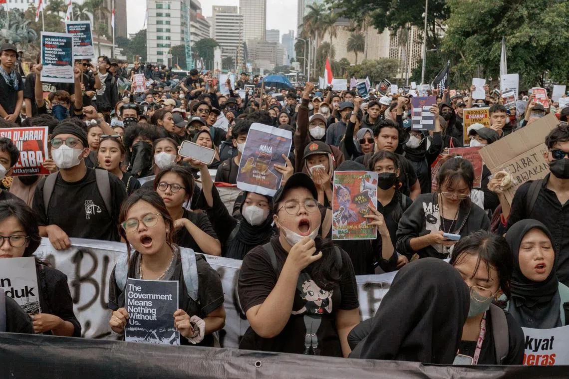 Demonstrators during a protest against Indonesian President Prabowo Subianto near the Presidential Palace in Jakarta, Indonesia, on Friday, Feb. 21, 2025. Opposition is growing against Prabowo’s call for “budget efficiency” that’s reminiscent of the deep spending cuts that are happening both in Vietnam and in the US. Photographer: Muhammad Fadli/Bloomberg