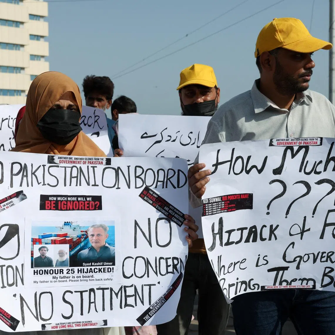 Families of the Pakistani hostage crew members of the Oil Products Tanker the HONOUR 25 that was hijacked by pirates off the coast of Somalia, hold placards during a protest, calling the government to take immediate action for the safe return of their loved ones, in Karachi, Pakistan May 13, 2026. REUTERS/Akhtar Soomro