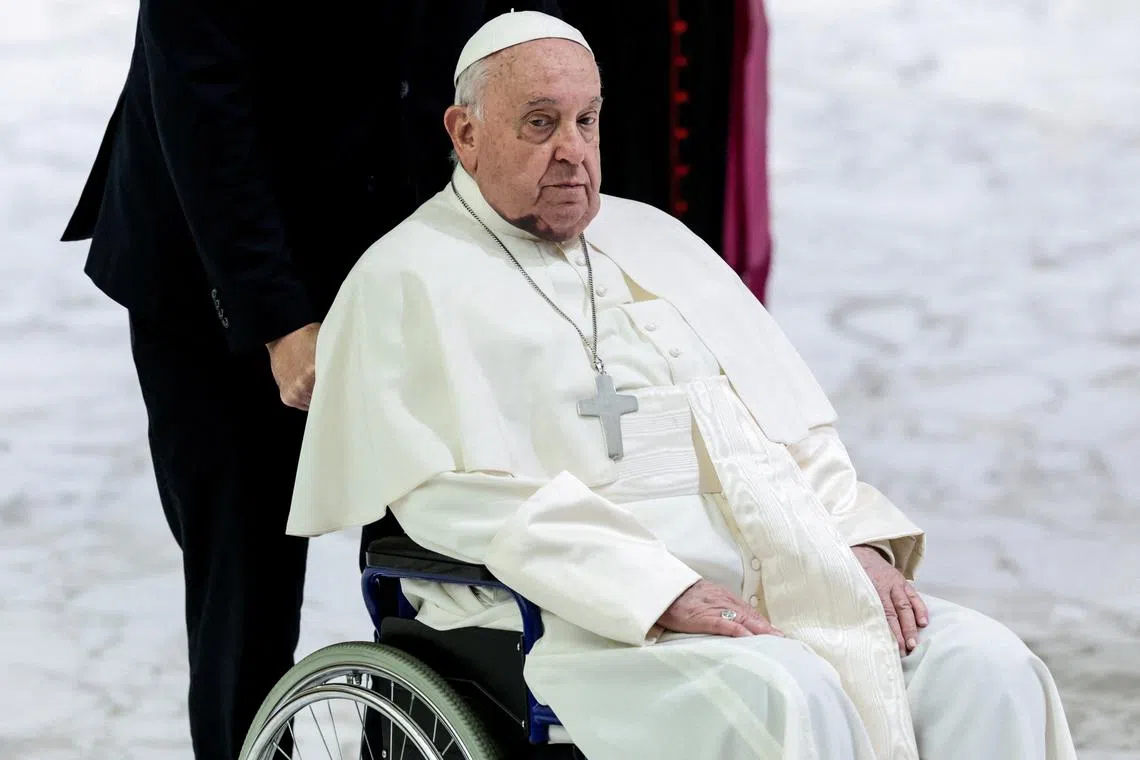 Pope Francis, with a large bruise on his chin, attends the weekly general audience, in Paul VI hall at the Vatican, December 11, 2024. REUTERS/Remo Casilli