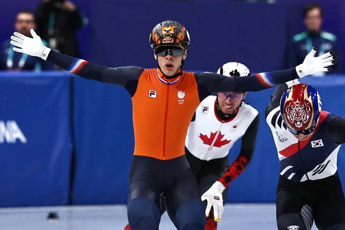 Milano Cortina 2026 Olympics - Short Track Speed Skating - Men's 1500m - Finals - Milano Ice Skating Arena, Milan, Italy - February 14, 2026. Jens van 't Wout of Netherlands celebrates as he crosses the finish line to win the gold medal. REUTERS/Amanda Perobelli