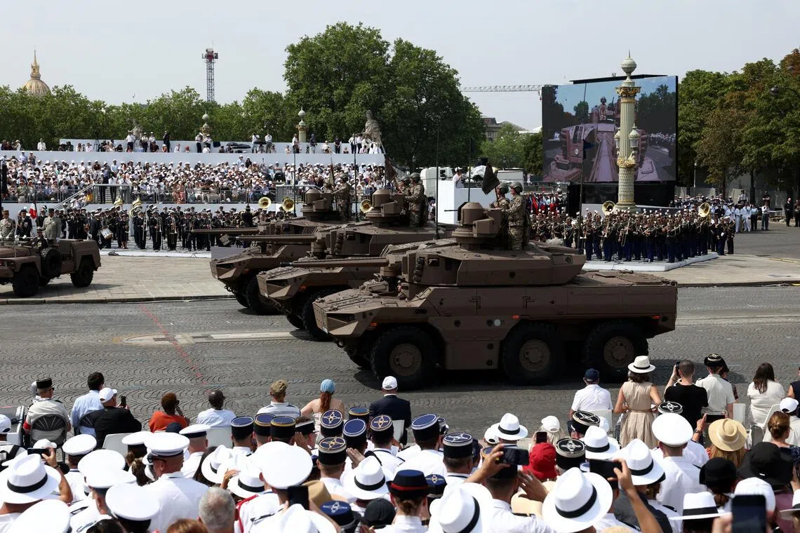 The parade marks the storming of the Bastille fortress in the French revolution.
