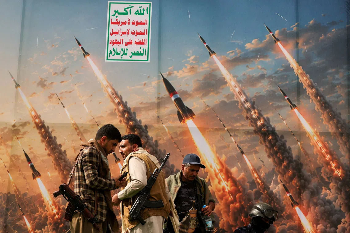 FILE PHOTO: Houthi activists stand on a platform against a banner depicting Houthi missiles, at an anti-Saudi rally amid an escalation with the kingdom, in Sanaa, Yemen, July 31, 2026. REUTERS/Khaled Abdullah/File Photo
