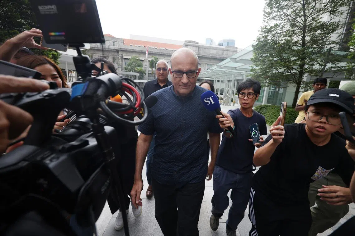 Former transport minister S. Iswaran arriving at the State Courts on Oct 7.