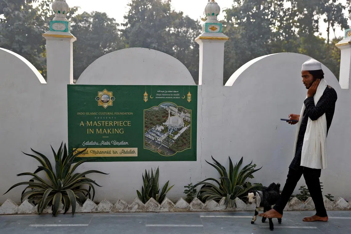 FILE PHOTO: A Muslim man walks his goat at a site that was allotted by the authorities for a new mosque, about 15 miles from the Hindu Ram Temple, in Ayodhya in the northern state of Uttar Pradesh, India, November 23, 2023. REUTERS/Anushree Fadnavis/File Photo