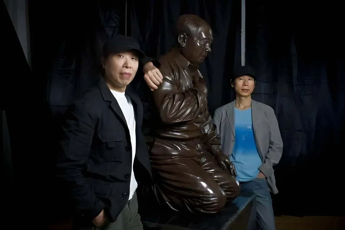 Gao Zhen (left) and his brother Gao Qiang with their artwork, titled Mao’s Guilt, in Beijing in 2009.