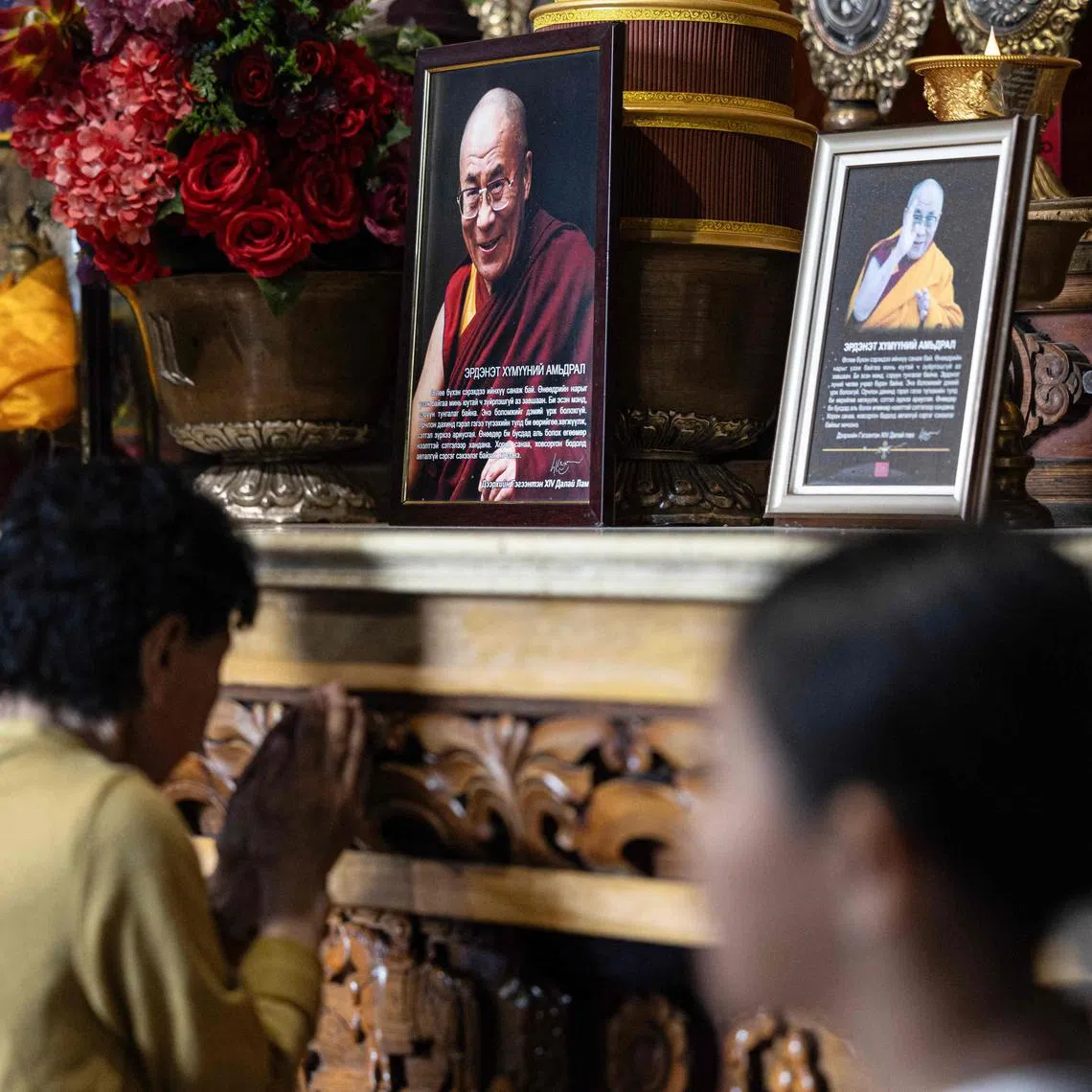 A portrait of Tibetan spiritual leader the Dalai Lama (centre top) is seen at the Gandantegchinlen Monastery in Ulaanbaatar, Mongolia on July 4, 2025.  
