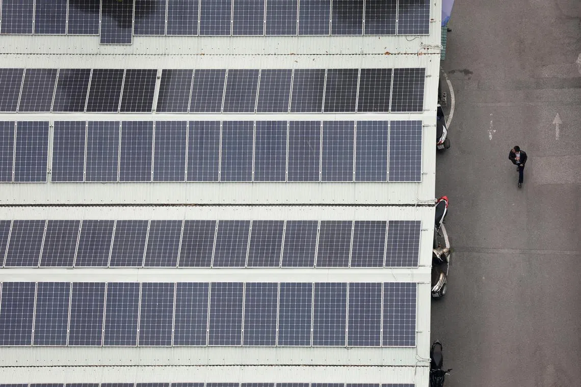 epa11002891 Solar panels are seen on the rooftop of a parking garage in Hanoi, Vietnam, 30 November 2023. The Vietnamese government has prioritized solar power development on the rooftops of buildings, especially in regions at risk of a shortage of electricity. Vietnam is expected to increase the share of renewable energy as primary energy to around 20 percent by 2030.  EPA-EFE/LUONG THAI LINH
