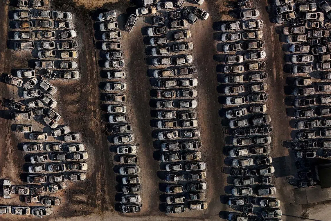 Burnt cars following a wildfire in Dymi, near Patras, Greece Aug 14, 2025. 