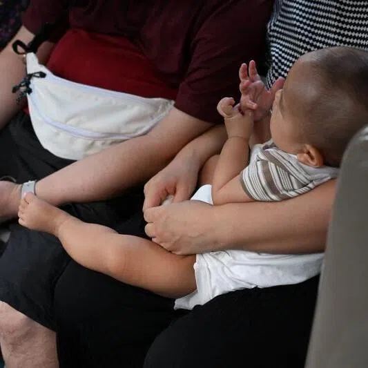 It is not easy to take care of parents and raise one’s own children at the same time, say the writers.