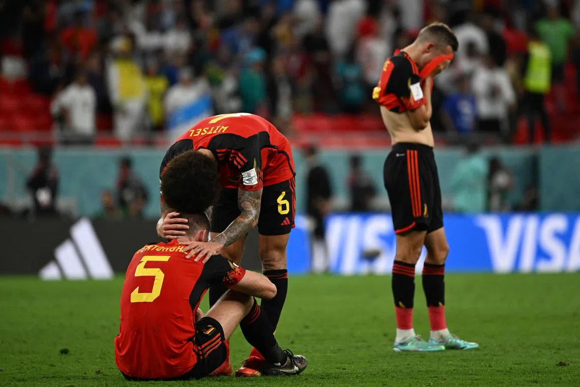 Belgium's Jan Vertonghen and Axel Witsel react after the match.