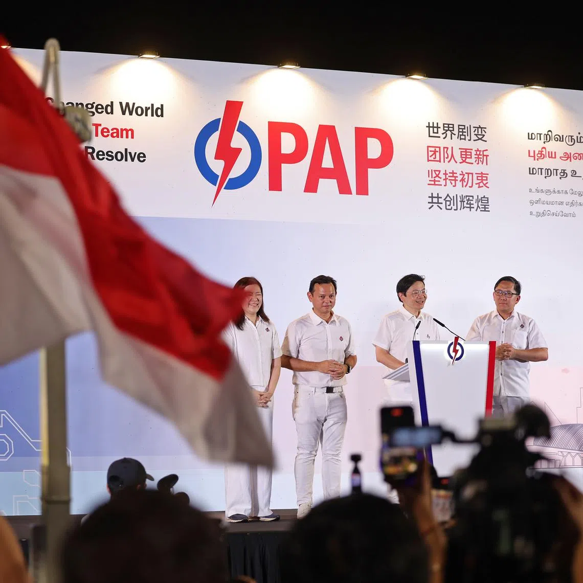 PM Lawrence Wong (second from right), with his fellow Marsiling-Yew Tee GRC teammates (from left) Hany Soh, Zaqy Mohamad and Alex Yam, addressing supporters at Yio Chu Kang Stadium on May 4.