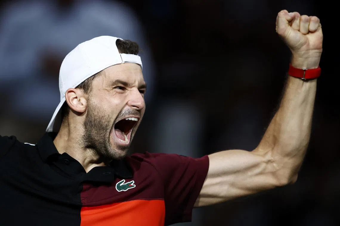 Grigor Dimitrov of Bulgaria celebrates winning his semi-final match against Stefanos Tsitsipas of Greece.