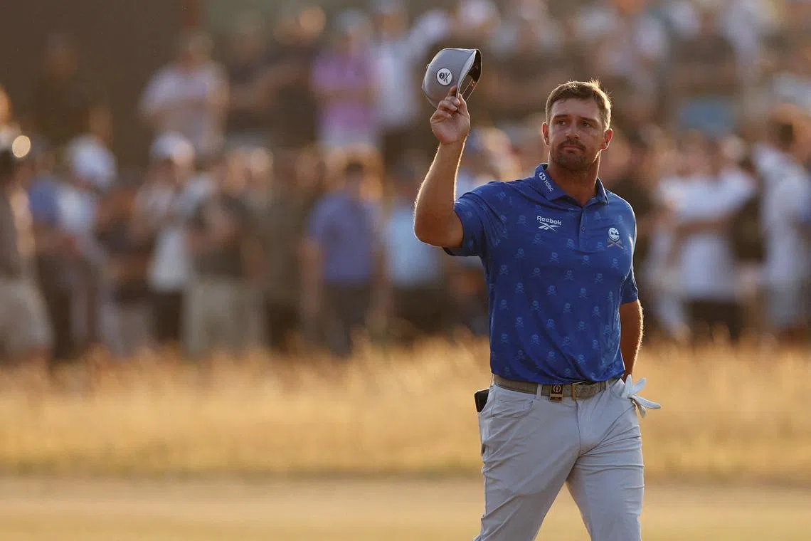 Golf - The 154th Open Championship - Royal Birkdale Golf Club, Southport, Britain - July 17, 2026  Bryson DeChambeau of the U.S. acknowledges fans on the 18th green during the second round REUTERS/Russell Cheyne     TPX IMAGES OF THE DAY