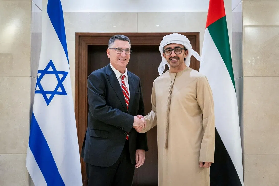 FILE PHOTO: United Arab Emirates Minister of Foreign Affairs Sheikh Abdullah bin Zayed Al Nahyan shakes hands with Israel's Foreign Minister Gideon Sa'ar during a meeting in Abu Dhabi, United Arab Emirates, in this handout picture obtained by Reuters on January 7, 2025. WAM/Handout via REUTERS/File Photo