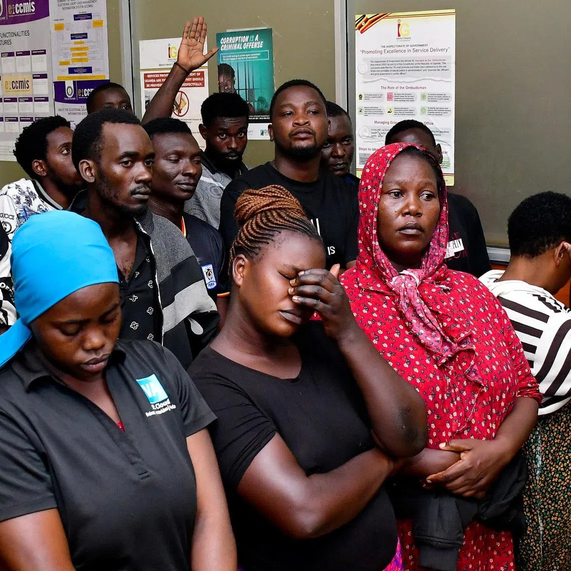 Suspects arrested for public nuisance, inciting violence and obstructing police officers during the recently concluded general elections stand at the City Hall Magistrate’s Court, where they were charged, in Kampala, Uganda, January 19, 2026. REUTERS/Abubaker Lubowa