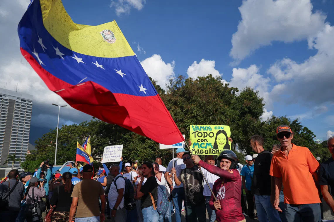 Supporters of Venezuela's opposition take part in a demonstration to demand elections in 2027, in Caracas, Venezuela, October 22, 2026. REUTERS/Fausto Torrealba