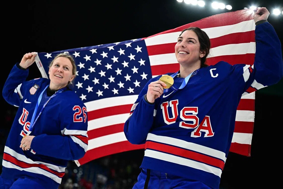 The US' Kendall Coyne (left) and Hilary Knight celebrating during the medal ceremony for the women's ice hockey event at the Milano Santagiulia Ice Hockey Arena during the 2026 Milano-Cortina Winter Olympic Games in Milan, on Feb 19, 2026.