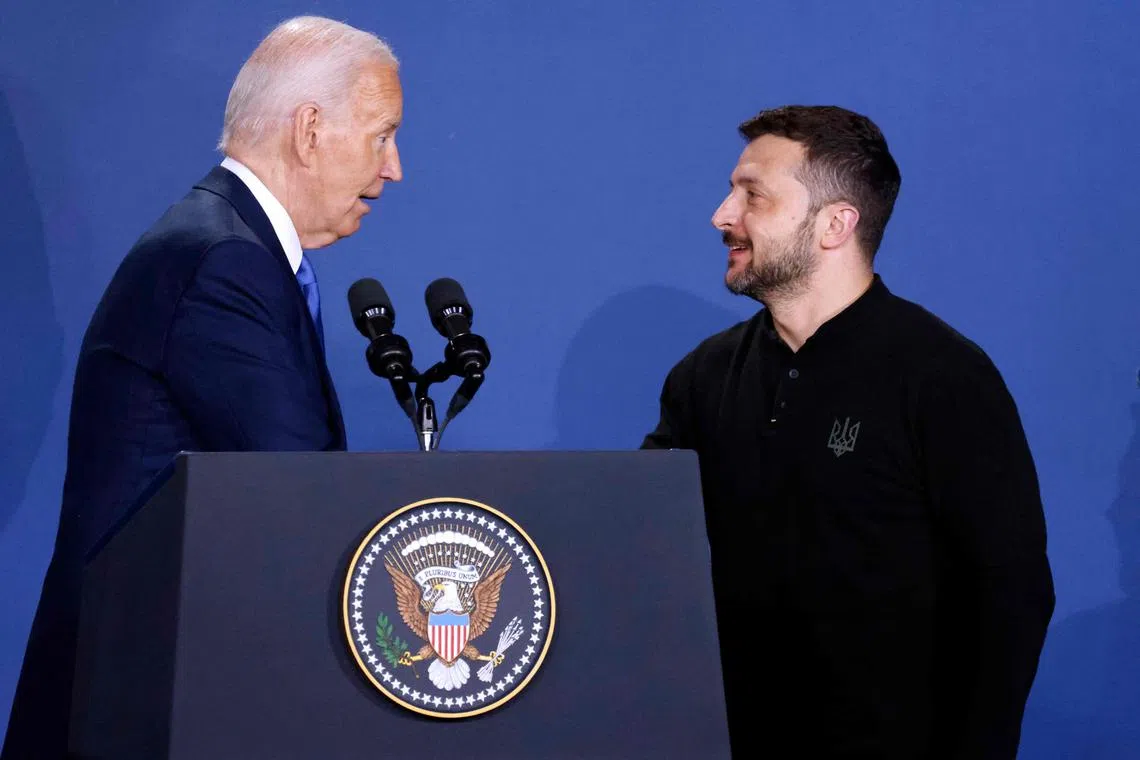 US President Joe Biden (left) mistakenly introduced Ukraine President Volodymyr Zelensky as "President Putin".