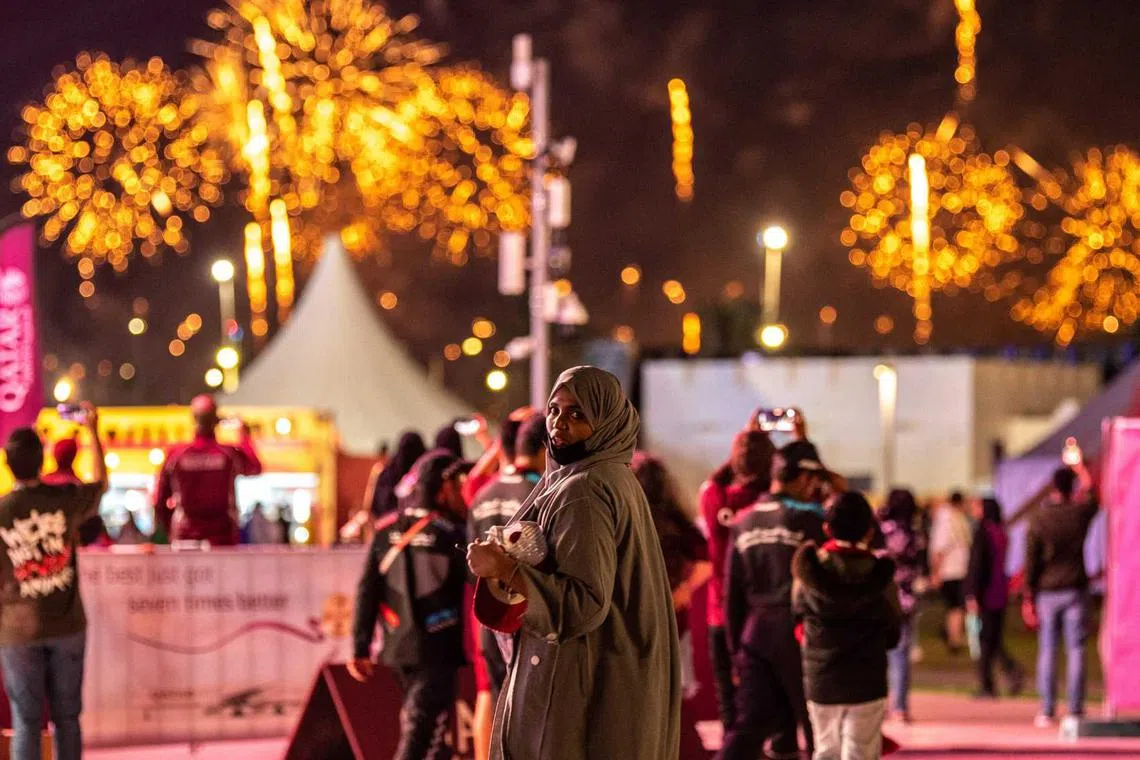Football fans leave after watching the Group A match between Qatar and Ecuador as they attend the FIFA Fan Festival at Al Bidda park in Doha on Nov 20, 2022, on the opening of the Qatar 2022 World Cup football tournament. 