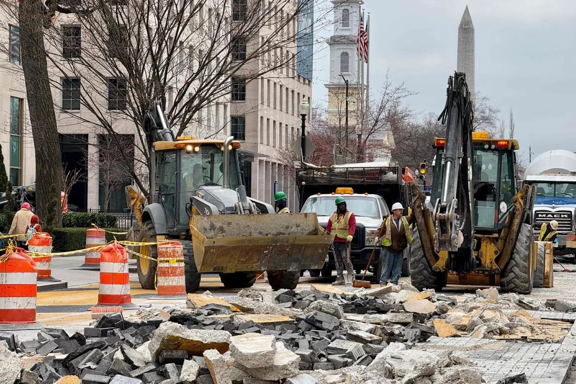 Workers demolishing the Black Lives Matter Plaza in Washington on March 14.