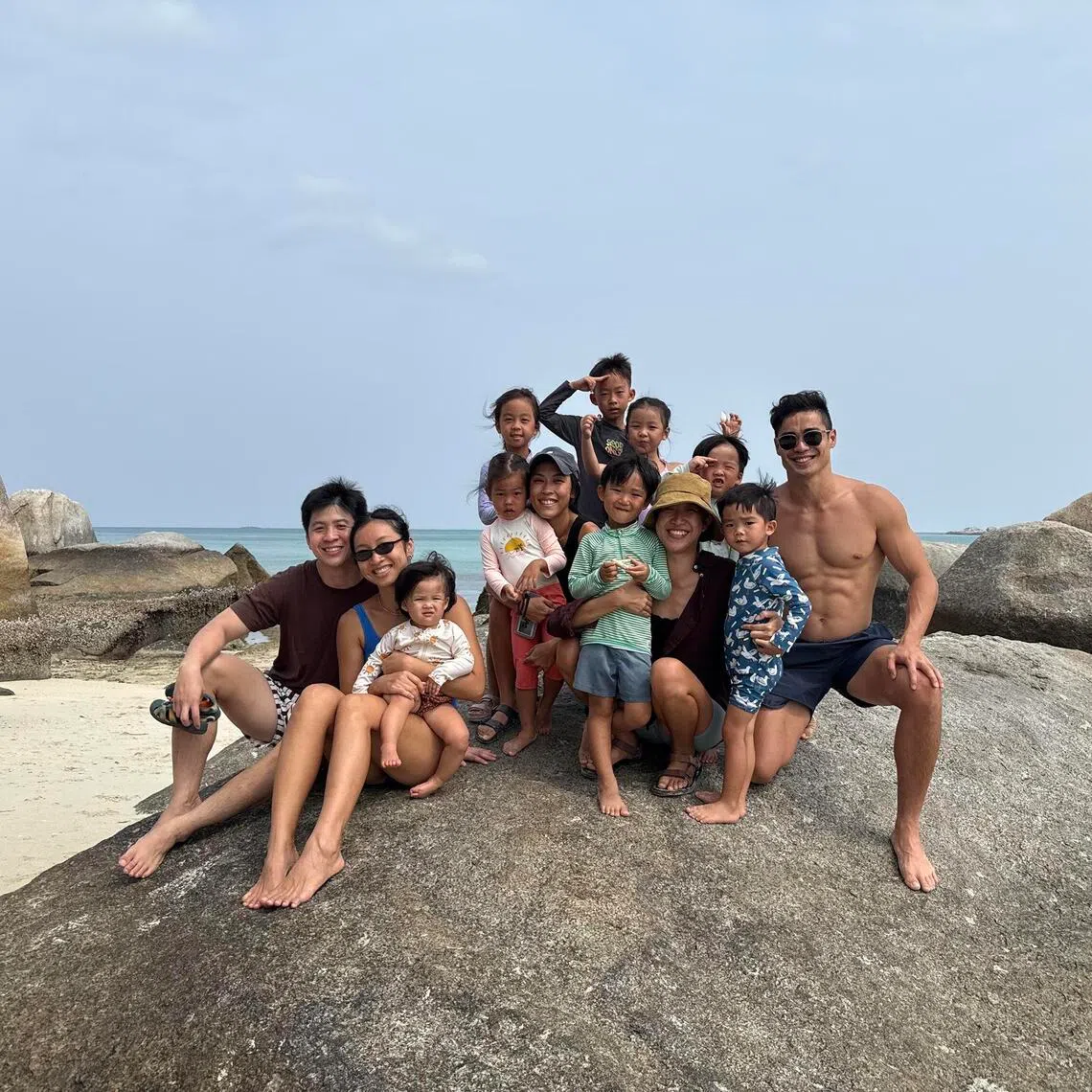 aafly - Singaporean Zachary Lee (extreme right) with his family, his friends and their families on vacation in Belitung.
ST Photo: Hariz Baharudin