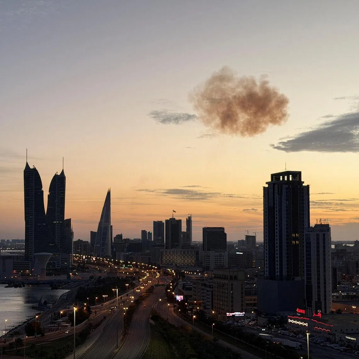 Smoke rises after an Iranian drone was intercepted over the Bahrain Financial Harbour towers, which houses the Israeli embassy, in Manama, Bahrain, on March 6.