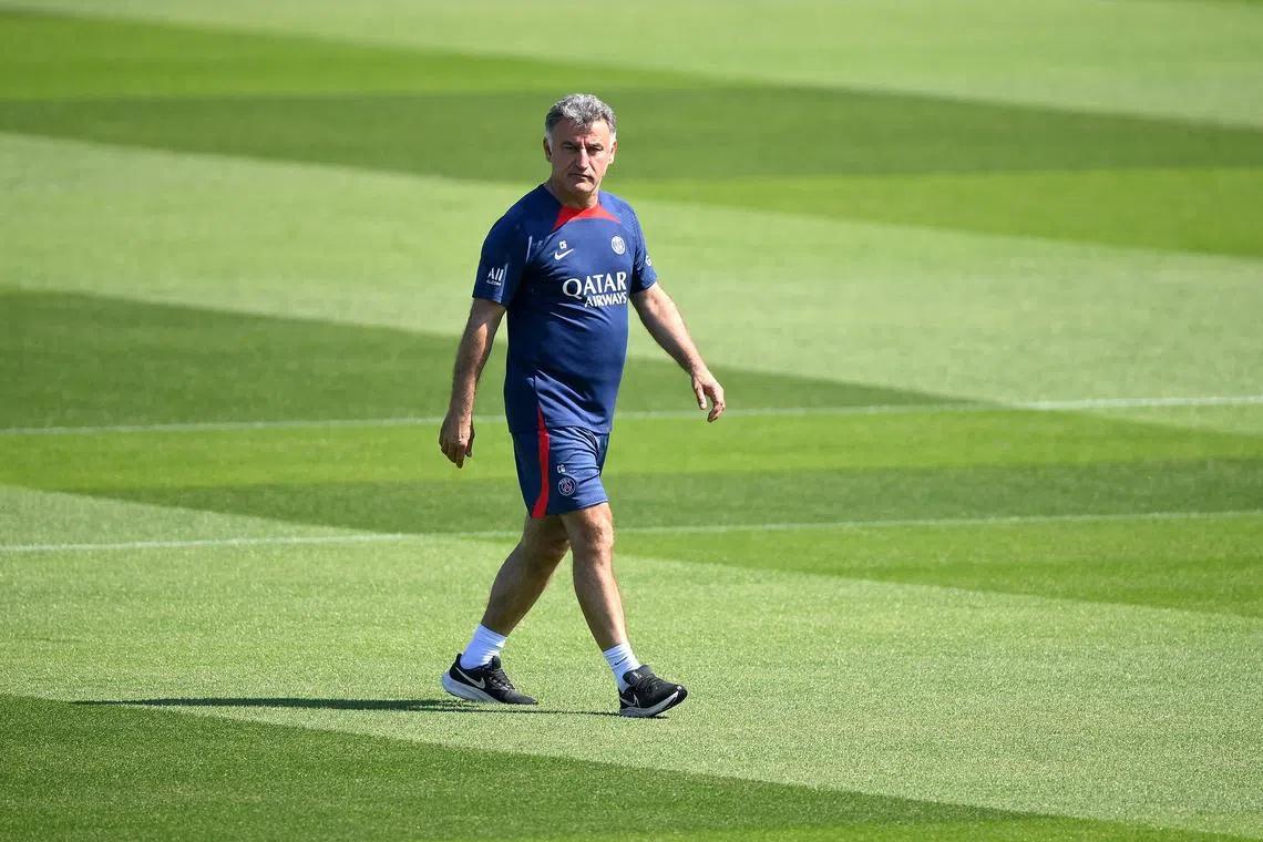 Paris Saint-Germain's French head coach  Christophe Galtier walks on the pitch during a training session at club's training ground in Saint-Germain-en-Laye, west of Paris on June 1, 2023, two days prior to the L1 football match against Clermont. (Photo by FRANCK FIFE / AFP)